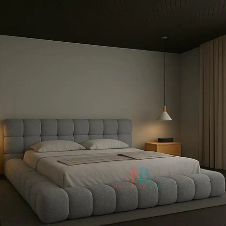Modern grey teddy fabric bubble bed frame with padded headboard and gas lift storage, styled in a minimal bedroom with wooden nightstands and pendant lighting
